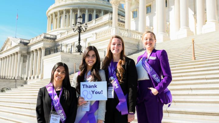 young women with thank you sign