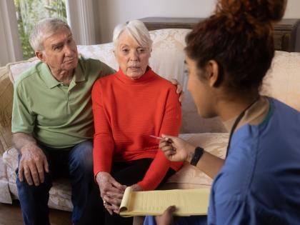 An image of a Couple with a Health Aide