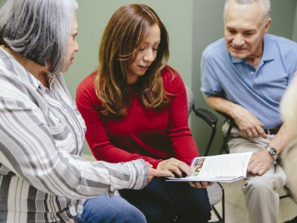 Patient with Family Looking at Pamphlet