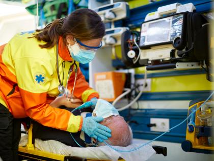 female tech in ambulance with patient