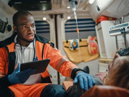 male tech inside ambulance with patient